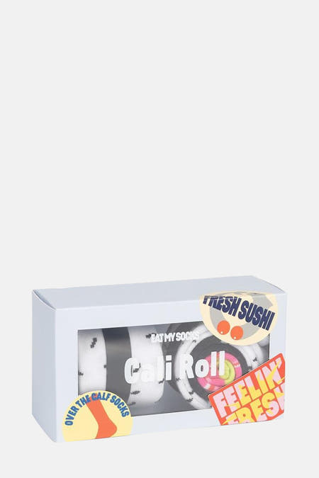 Chaussettes multicolores d'EAT MY SOCKS, emballées dans une boîte blanche avec des autocollants de sushi et de texte.