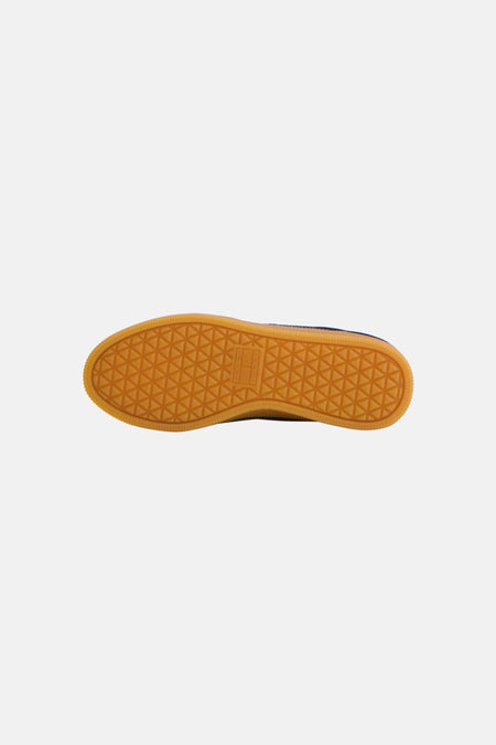 Blauwe sneakers van TOMMY JEANS met oranje rubberzool en geometrisch profiel, onderaanzicht