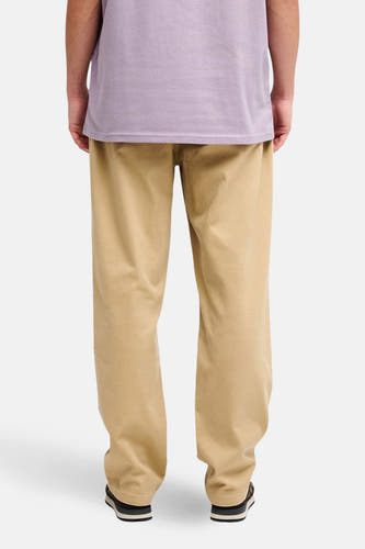 Beige broek van Quiksilver, gezien vanaf de achterkant, met een losse pasvorm en een effen ontwerp.