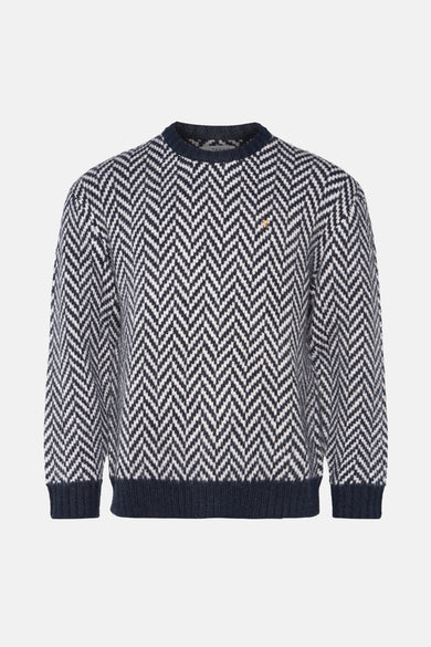 Marineblauwe trui met visgraatmotief.