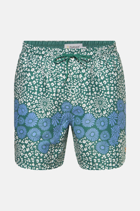 Maillot de bain vert de FARAH avec des fleurs bleues et un imprimé zèbre blanc.