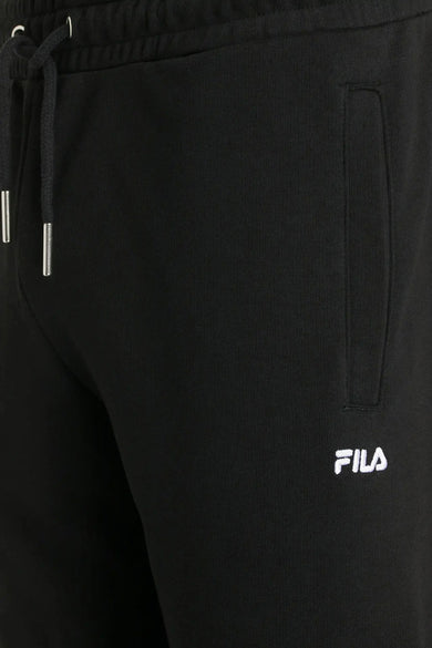 Pantalon de jogging noir FILA avec logo blanc, taille élastique et cordon argenté, gros plan avant