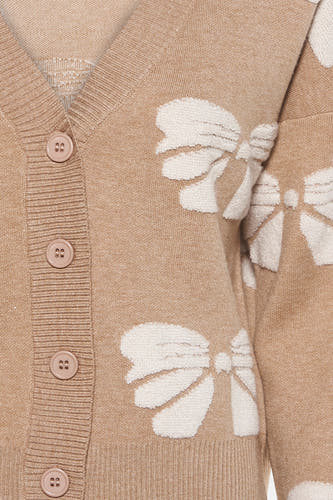 Beige vest van HAILYS met geborduurde strikken en knoopsluiting.
