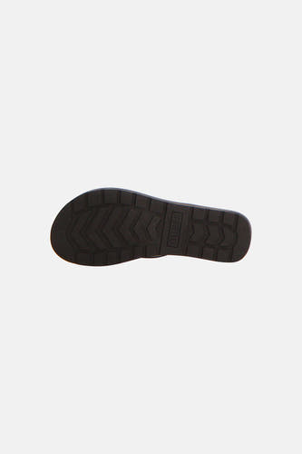 Zwarte slippers van Guess met grove geprofileerde zool en verticaal Guess logo.