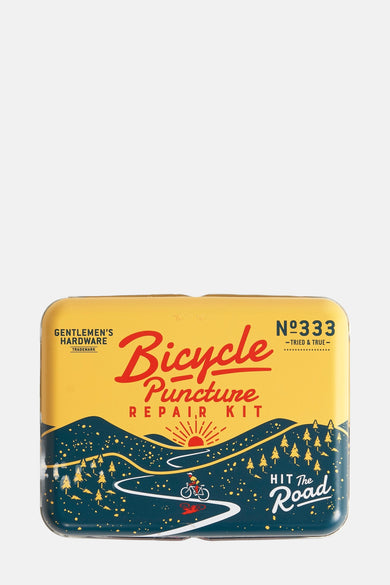 Multikleurige fietsreparatieset van Gentlemen's Hardware met illustraties van een kronkelende weg en dennenbomen.