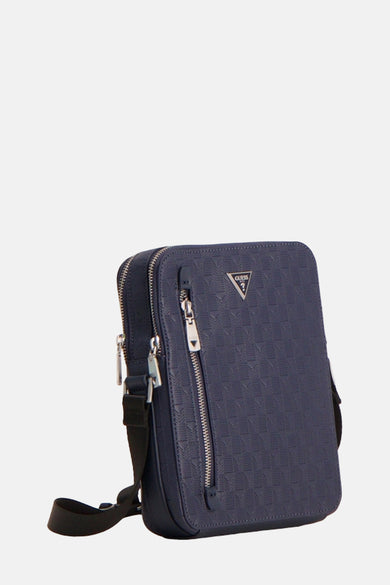 Sac à dos bleu de Guess avec fermeture éclair et motif de logos.
