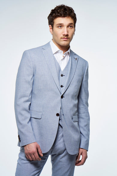 Blauwe blazer van Le Fabuleux Marcel de Bruxelles, met een fijne structuur en bijpassend gilet.