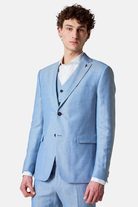 Blazer bleu de Le Fabuleux Marcel de Bruxelles, avec une subtile texture en écailles de poisson et un gilet coordonné.