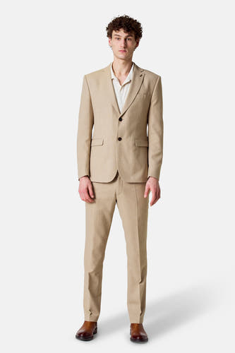 Blazer beige de Le Fabuleux Marcel de Bruxelles, avec des boutons bruns et une subtile texture.