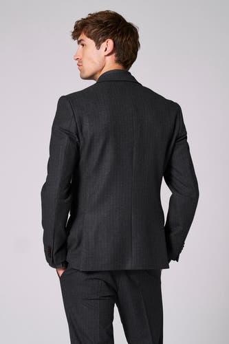 Blazer marron de Le Fabuleux Marcel de Bruxelles, vu de derrière, avec une texture subtile et un pantalon coordonné.