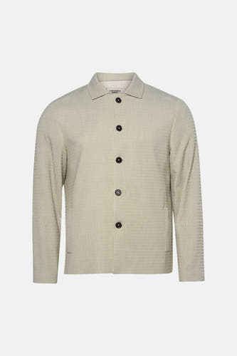 Blazer beige de Le Fabuleux Marcel de Bruxelles, avec fines rayures verticales et fermeture à boutons.