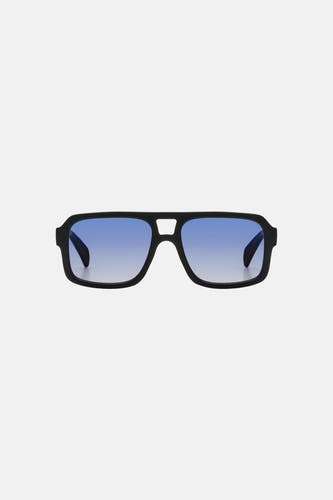 Lunettes de soleil noires KOMONO, avec montures rectangulaires et verres teintés en bleu.
