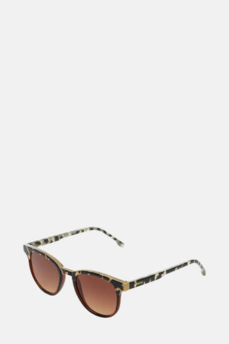 Lunettes de soleil KOMONO, avec un cadre tacheté et des verres bruns.