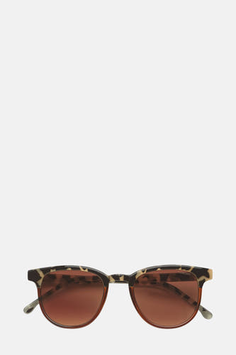 Lunettes de soleil KOMONO en couleur brun avec monture imprimée léopard et verres ronds.