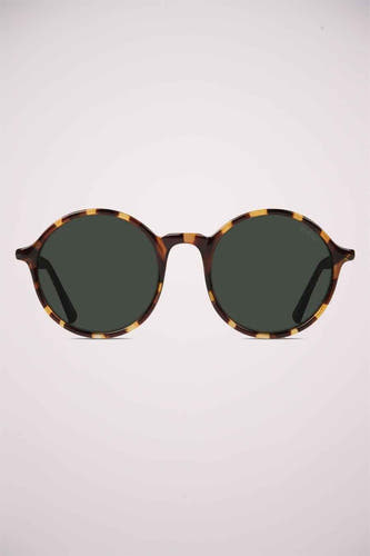 Lunettes de soleil vertes de KOMONO, avec un cadre en motif tortue.