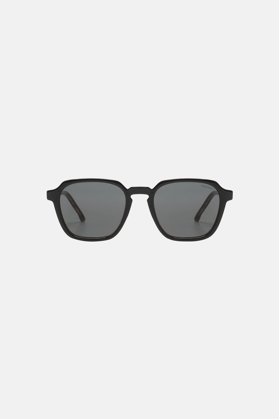 Zwarte zonnebril van KOMONO, met een minimalistisch montuur en donkere glazen.