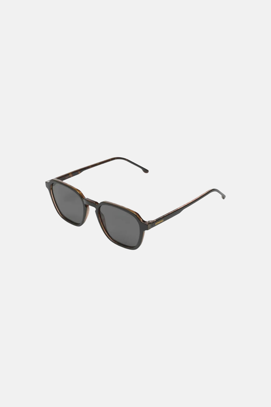 Zwarte zonnebril van KOMONO met donkere glazen en een geometrisch tortoiseshell montuur.