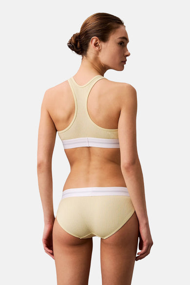 Gele beha van Calvin Klein, met witte band, achterkant weergegeven.
