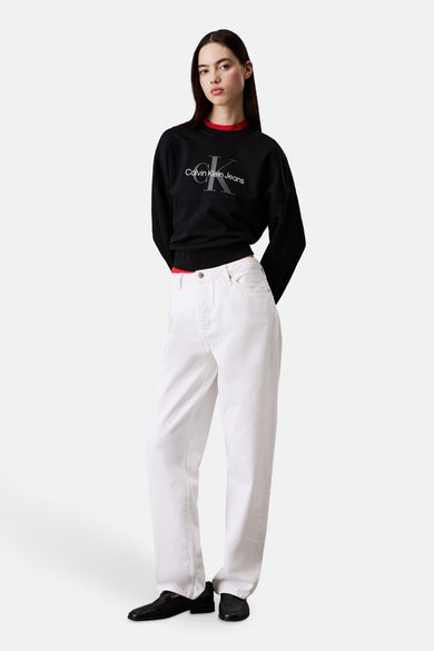 Gilet noir de Calvin Klein Jeans, avec des manches longues et un col rouge.