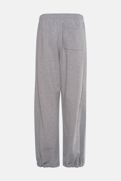 Pantalon de jogging gris de Calvin Klein, avec une ceinture élastique et un poche arrière.