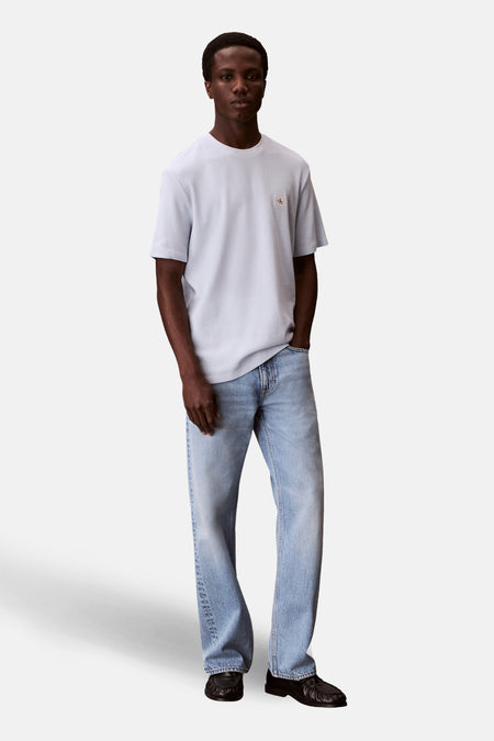 Blauw T-shirt met korte mouwen van Calvin Klein, met een textuurmotief en een klein logo op de borst.