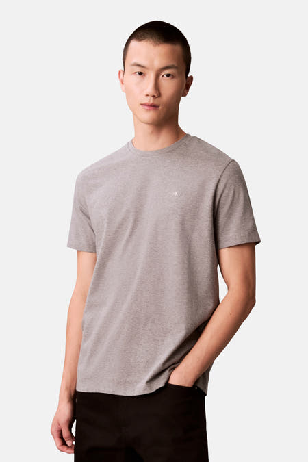 Grijs T-shirt met korte mouwen van Calvin Klein, effen design met kleine logo details.