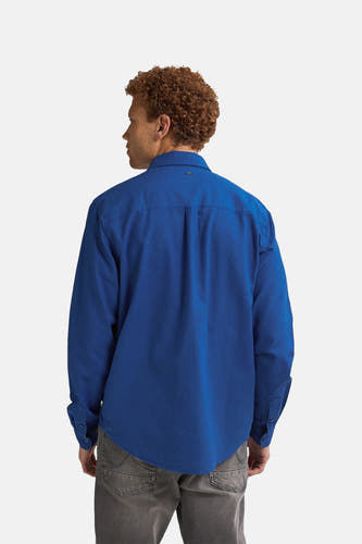 Blauw heren overhemd met lange mouwen van Petrol Industries®, rugzijde getoond, gecombineerd met grijze jeans.