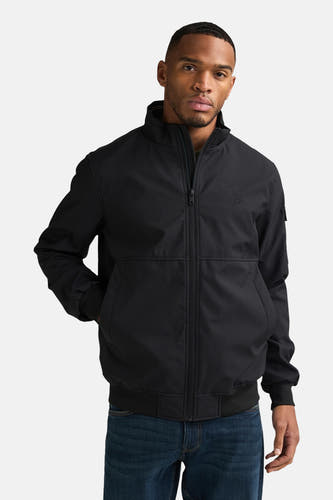 Zwarte korte jas van Petrol Industries® met ritssluiting en steekzakken, gedragen met een donkerblauwe jeans.