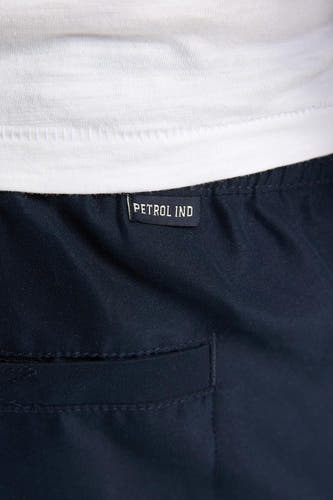 Blauwe zwemshort van Petrol Industries, met een elastische tailleband en een achterzak.