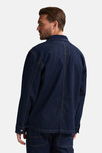 Blauwe jeansjas van Petrol Industries, gezien van achteren met contrasterende stiksels.