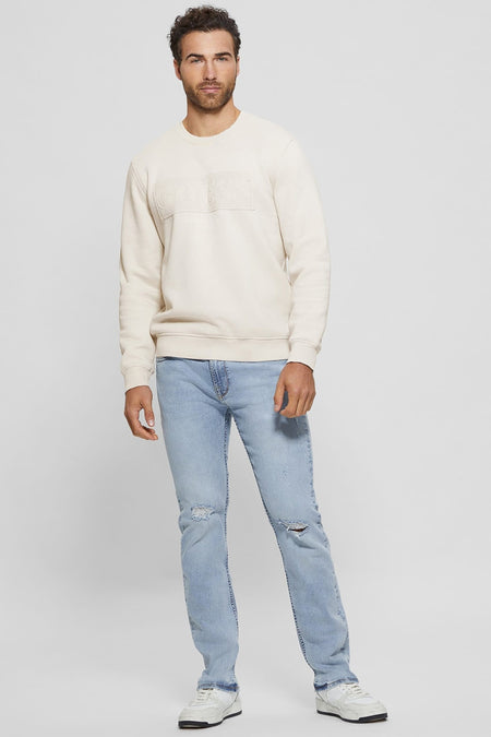 Ecru ronde hals sweater van Guess met reliëf Guess Los Angeles logo op de voorkant.