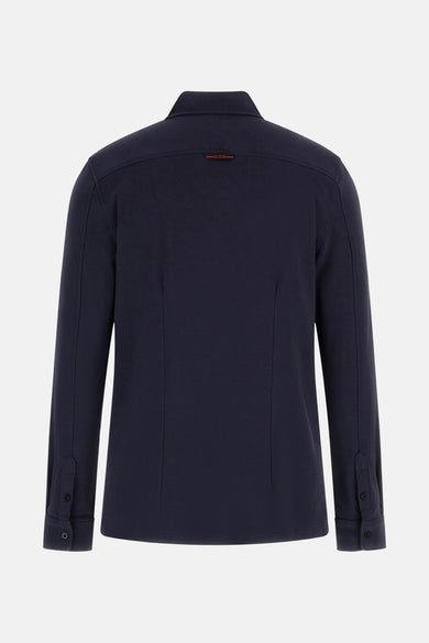Blauw overhemd met lange mouwen van Guess, met subtiele naden en knoopsluiting op de manchetten.