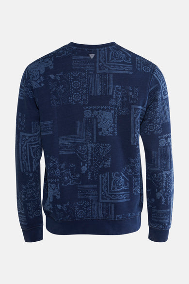 Blauwe sweater van Guess met een bandana patchwork motief.