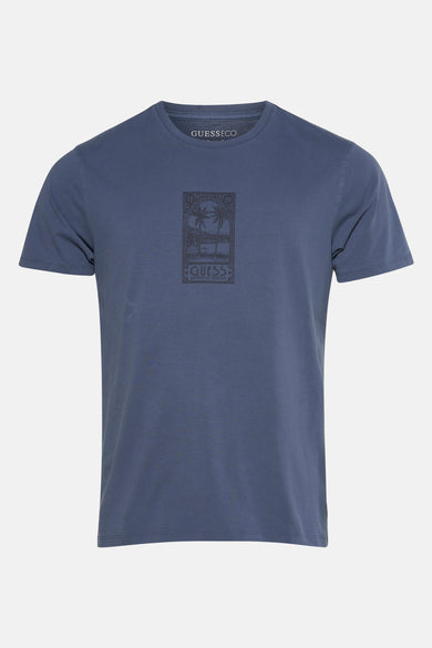 Blauw T-shirt met korte mouwen van Guess, met een grafische print van palmbomen.
