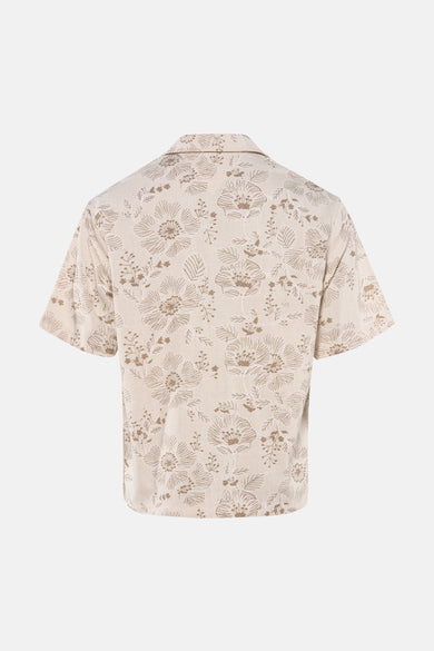 Beige overhemd met korte mouwen van Guess, met een bloemenpatroon.
