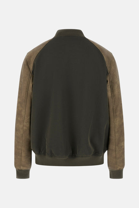 Donkergroen bomberjack met suède mouwen.