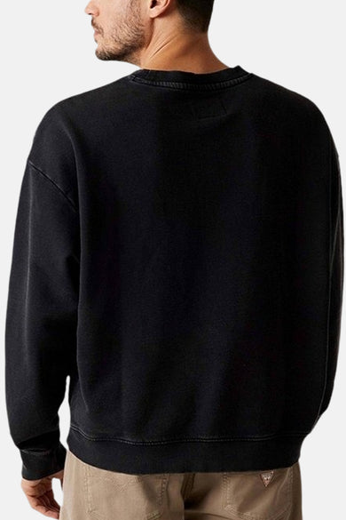 Zwarte sweater met ronde hals van Guess, achteraanzicht van de sweater met een effen stof.