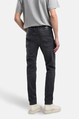 Donkergrijze slim fit jeans van REPLAY, gezien van achteren, met een effen ontwerp en subtiele stiksels.