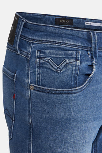 Slim jeans van blauw denim van Replay, met sierstiksels op de zakken.