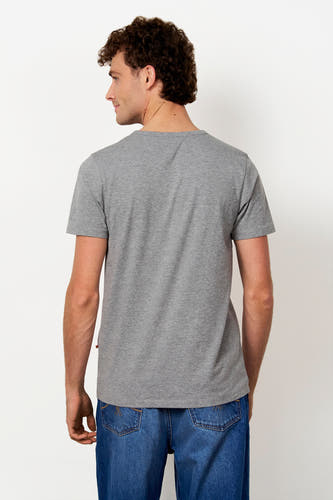 Grijs T-shirt met korte mouwen van Le Fabuleux Marcel de Bruxelles, gedragen door een man van achteren gezien, met blauwe jeans.