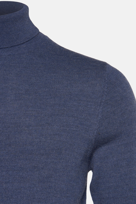 Veste bleue de Le Fabuleux Marcel de Bruxelles, avec une fine structure en côtes et des manches longues.