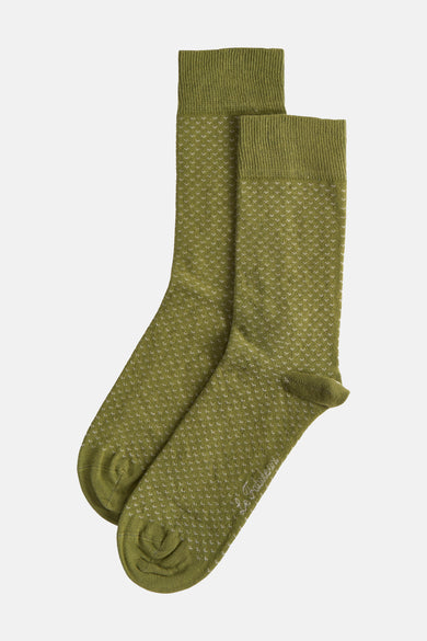 Chaussettes vertes de Le Fabuleux Marcel de Bruxelles, avec un motif blanc subtil sur toute la chaussette.