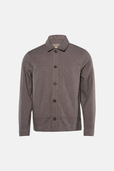 Veste courte marron de Le Fabuleux Marcel de Bruxelles, avec fermeture à boutons et poches plaquées.