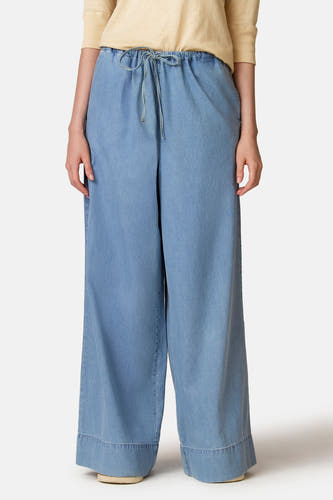 Jeans larges en denim bleu clair de Le Fabuleux Marcel de Bruxelles, avec cordon de serrage et jambes larges.