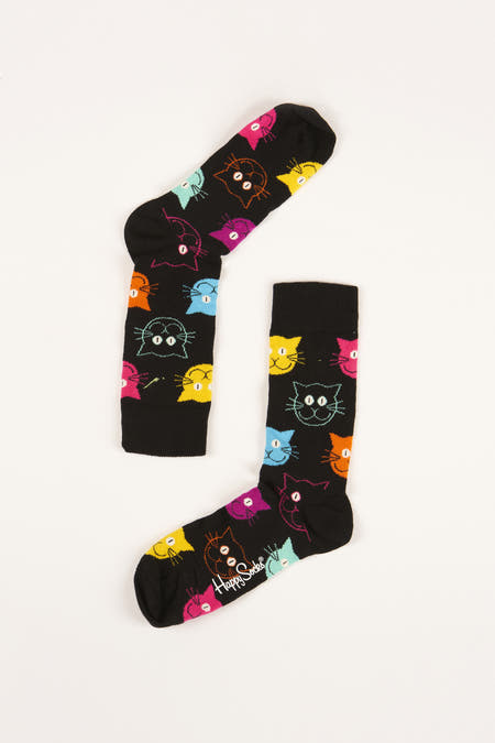 Chaussettes multicolores de Happy Socks, avec un motif noir de visages de chats.