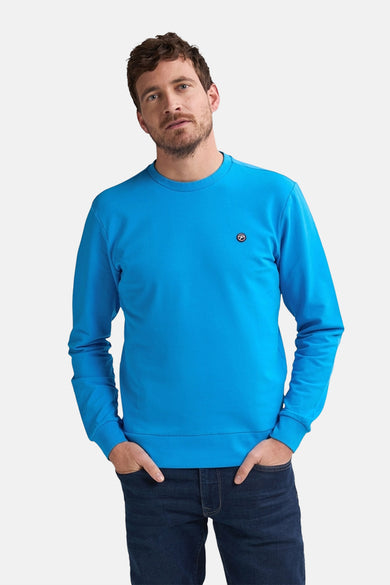 Gilet bleu de Petrol Industries, avec un petit logo sur la poitrine.