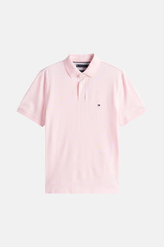 Roze polo met korte mouwen van TOMMY HILFIGER, met een klein geborduurd logo op de borst.