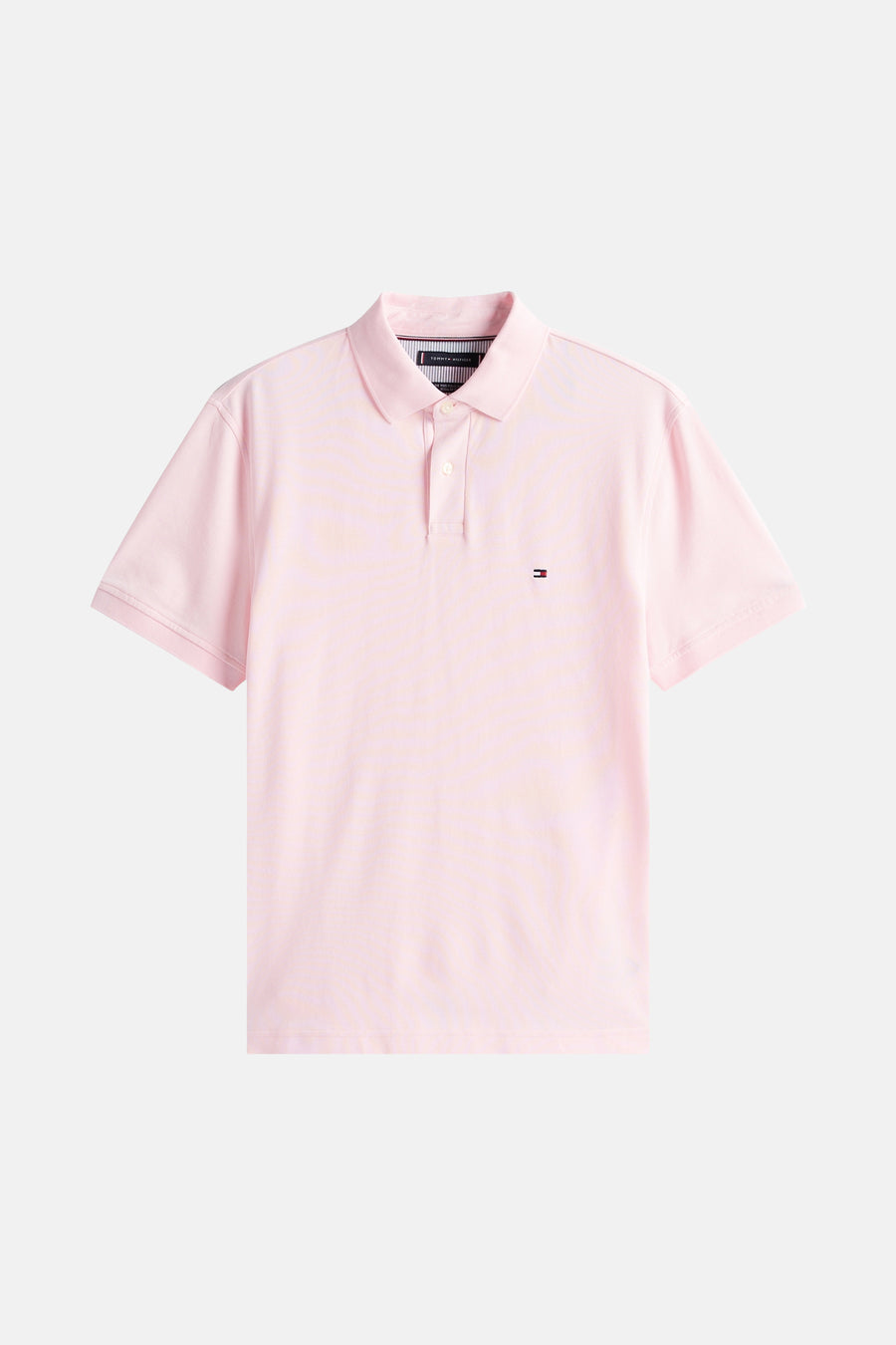 Roze polo met korte mouwen van TOMMY HILFIGER, met een klein geborduurd logo op de borst.