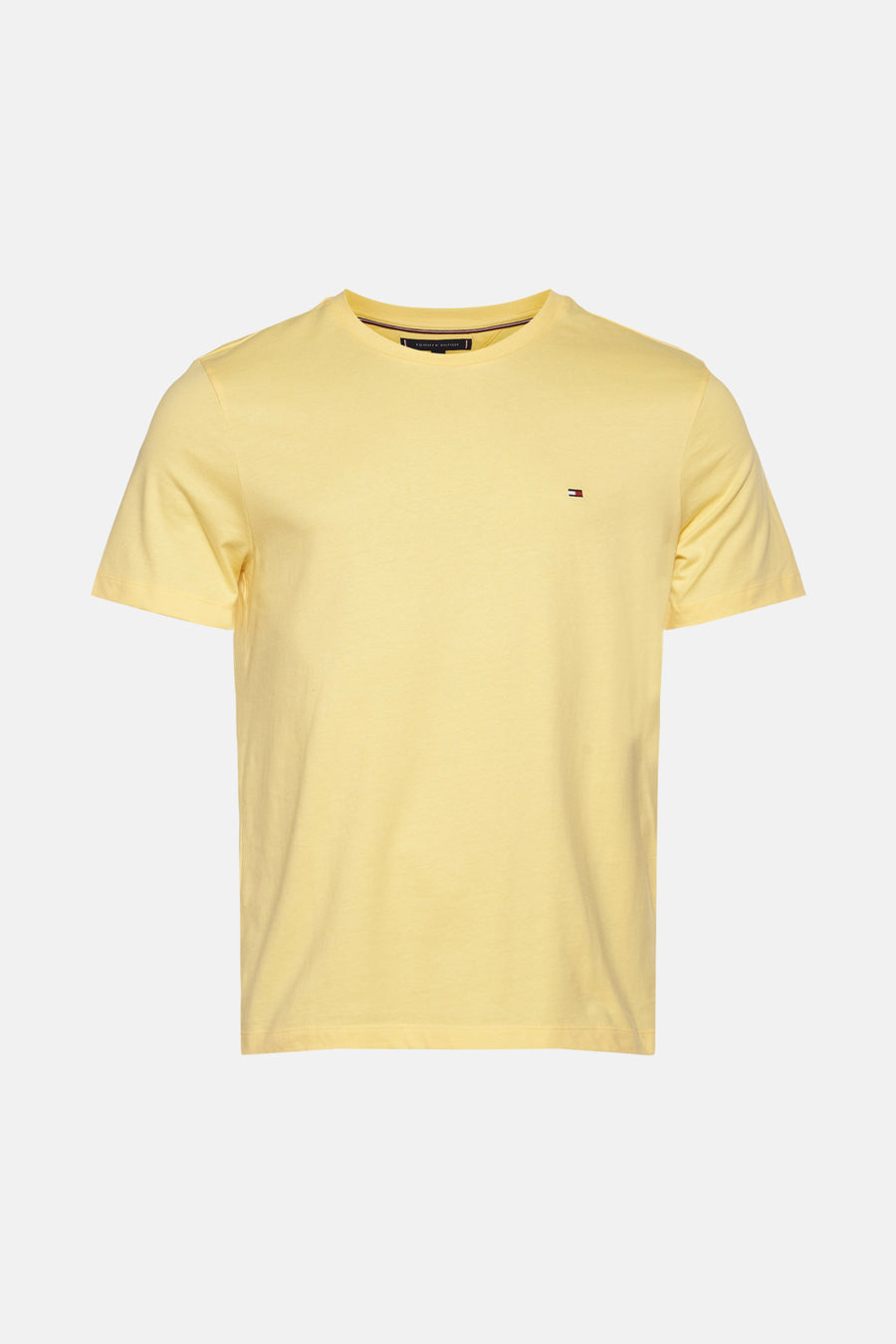 Geel T-shirt met korte mouwen van TOMMY HILFIGER, met een klein logo op de borst.