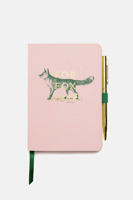 Article cadeau rose de DESIGNWORKS INK avec un stylo doré et un marque-page vert.